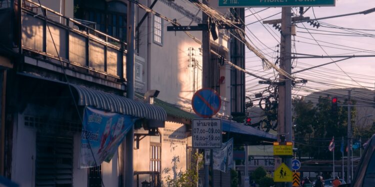 A street sign on a pole on a city street