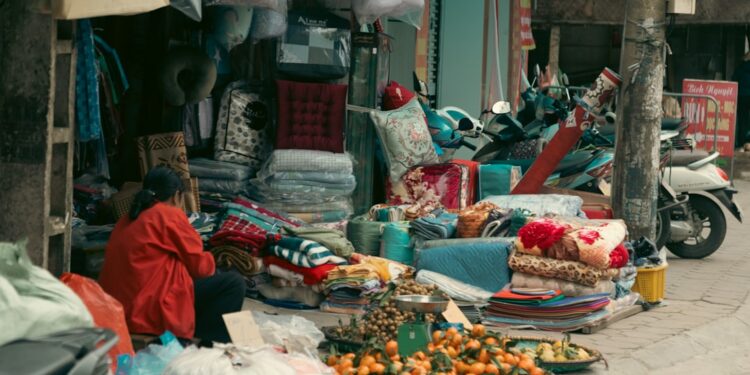 Street vendor selling fruits and textiles