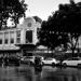 Monochrome street scene with building and cars