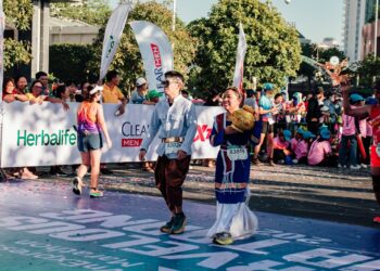 a couple of people that are standing in the street