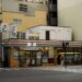 Candid street photo of a 7-Eleven convenience store in Japan.