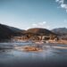 Beautiful landscape of Arashiyama mountains and river in Kyoto, Japan, under a clear blue sky.
