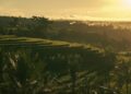 Scenic view of Bali rice terraces bathed in golden sunrise light.