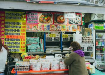 A vibrant Korean street food stall in Seoul, showcasing local culture and cuisine.