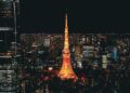 Stunning nighttime view of the Tokyo Tower glowing in the vibrant Tokyo skyline, Japan.