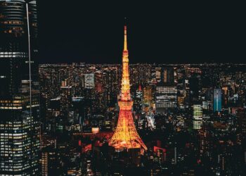 Stunning nighttime view of the Tokyo Tower glowing in the vibrant Tokyo skyline, Japan.