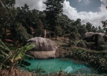 Discover the serene beauty of a lush tropical lagoon on Koh Samui, Thailand.