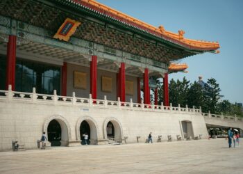 The stunning Taipei National Theater with traditional Chinese architecture under a clear sky.