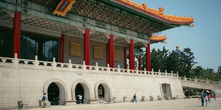 The stunning Taipei National Theater with traditional Chinese architecture under a clear sky.