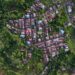 Stunning aerial photography of a village surrounded by lush greenery in Bengkulu, Indonesia.