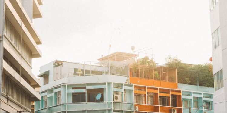 Vibrant cityscape of contemporary architecture in Bangkok, showcasing colorful residential buildings.