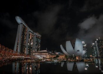 Stunning night view of Marina Bay Sands with reflections in Singapore's skyline.