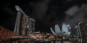 Stunning night view of Marina Bay Sands with reflections in Singapore's skyline.