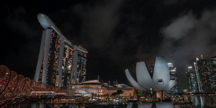 Stunning night view of Marina Bay Sands with reflections in Singapore's skyline.