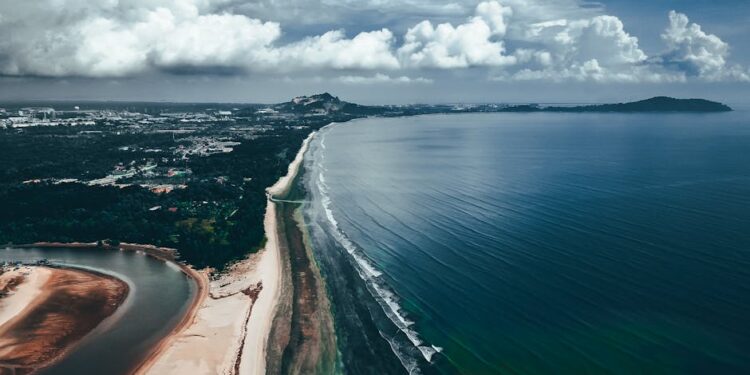 Stunning aerial view of Balok Beach in Pahang, Malaysia with coastal and cloud formations.