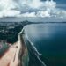 Stunning aerial view of Balok Beach in Pahang, Malaysia with coastal and cloud formations.