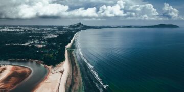 Stunning aerial view of Balok Beach in Pahang, Malaysia with coastal and cloud formations.