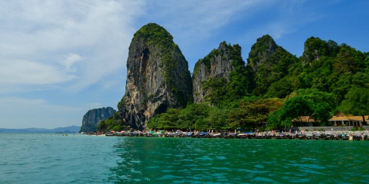 Discover the breathtaking beauty of Krabi, Thailand with iconic limestone cliffs, turquoise waters, and lush greenery.
