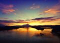 Mesmerizing sunset over a river in Tuaran, Sabah, Malaysia with vibrant sky and reflections.