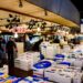 A vibrant scene at the Tsukiji Fish Market showcasing fresh seafood and active vendors in Tokyo, Japan.
